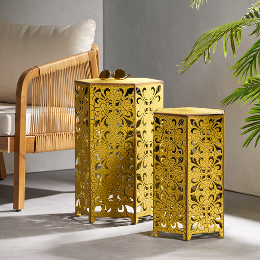 Set of two distressed gold hexagonal accent tables with filigree cutouts