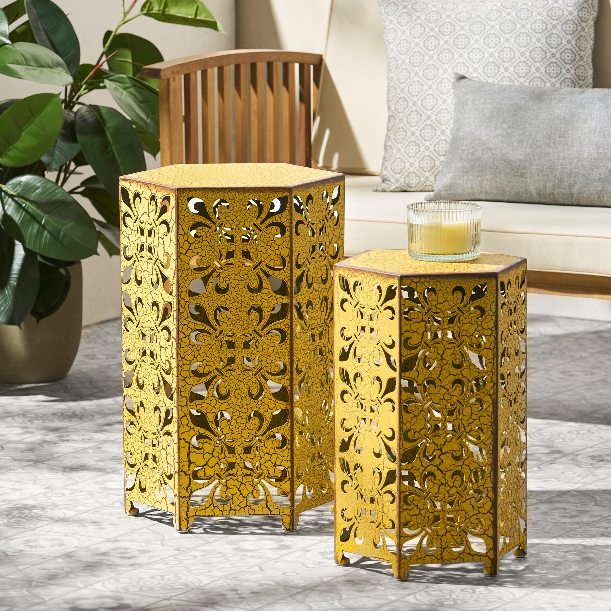 Antique yellow metal hexagonal garden side table with intricate cutout floral pattern