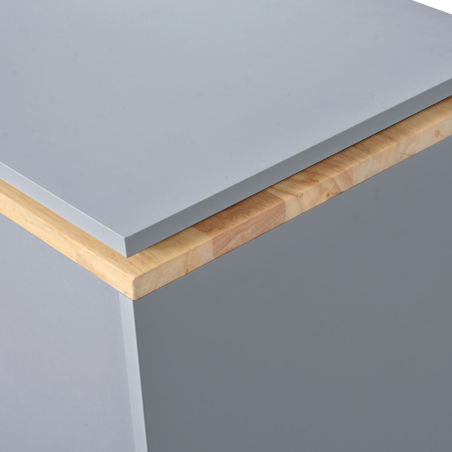 Close up of a gray cabinet with a natural wood trim
