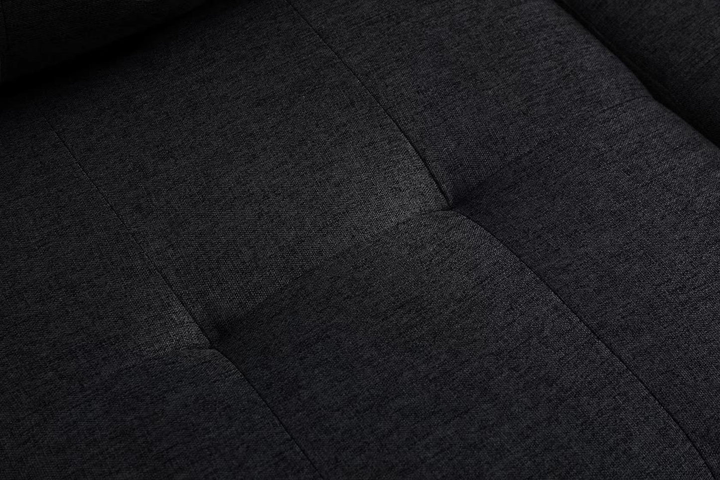 Dark grey textured fabric sofa cushion with button tufting