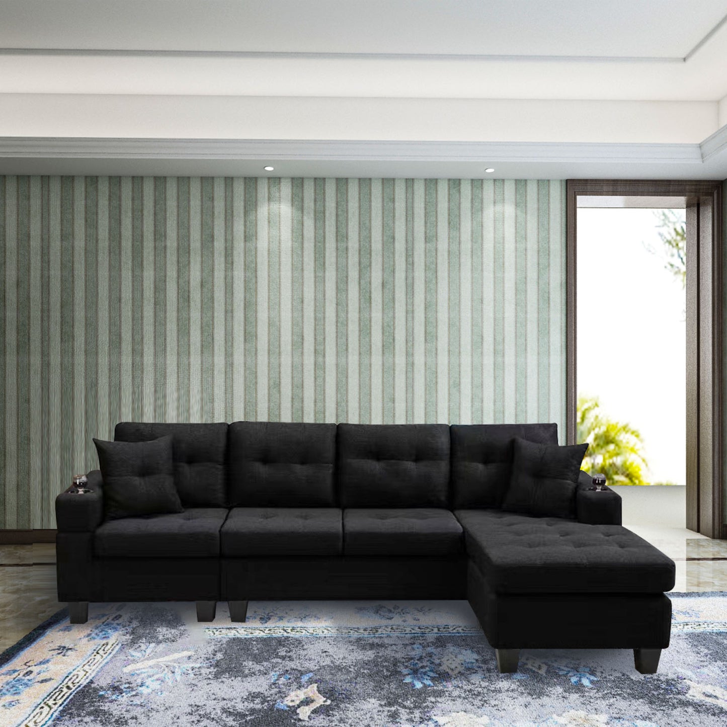 Black upholstered sectional sofa with tufted cushions and builtin cup holders