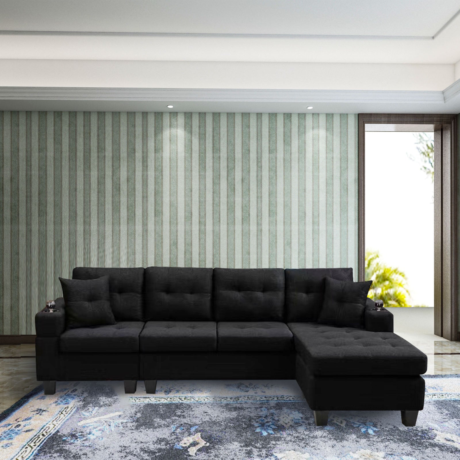 Black upholstered sectional sofa with tufted cushions and builtin cup holders