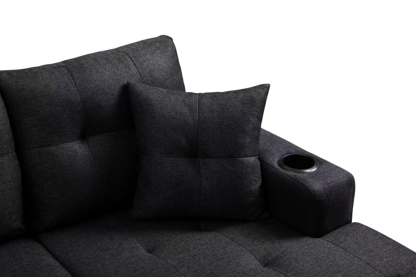 Dark gray fabric sectional sofa with tufted cushions and a builtin cup holder