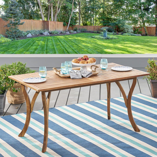 Rectangular acacia wood patio dining table with slatted top and curved legs