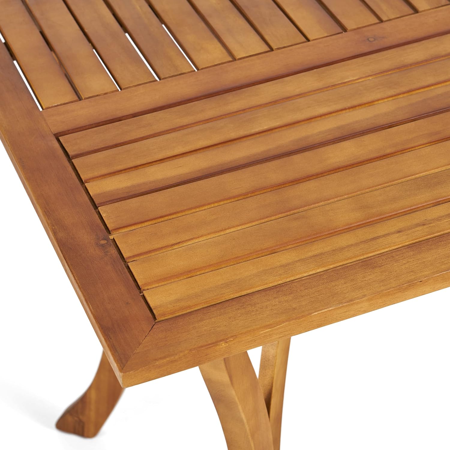 Closeup of a slatted wooden dining table surface showcasing natural wood grain
