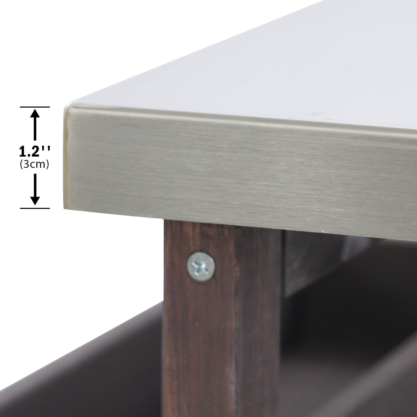 Closeup of stainless steel countertop edge with brushed finish and wooden legs