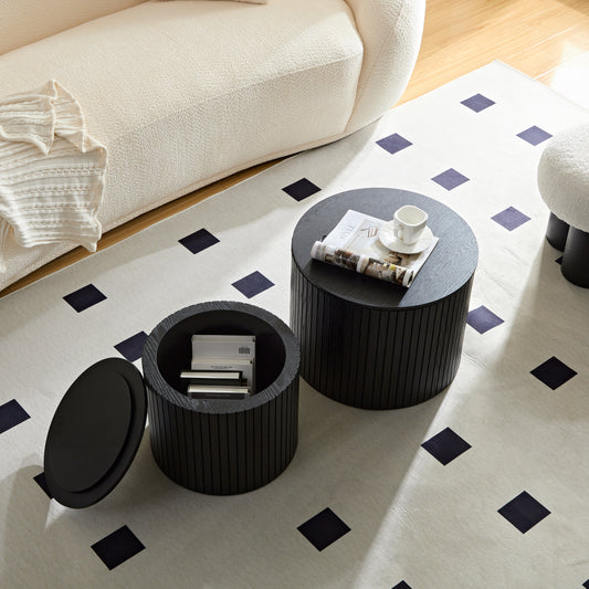 Black wooden coffee table with ribbed detail and open storage showing books