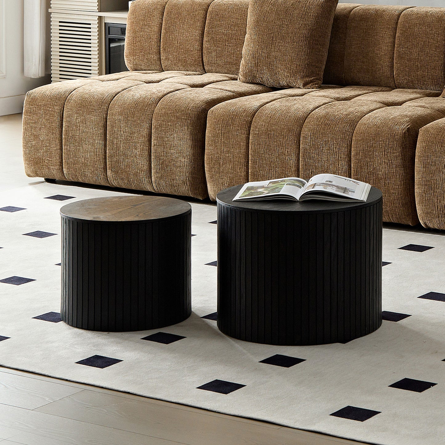 Modern black cylindrical coffee table with ribbed texture and oak top
