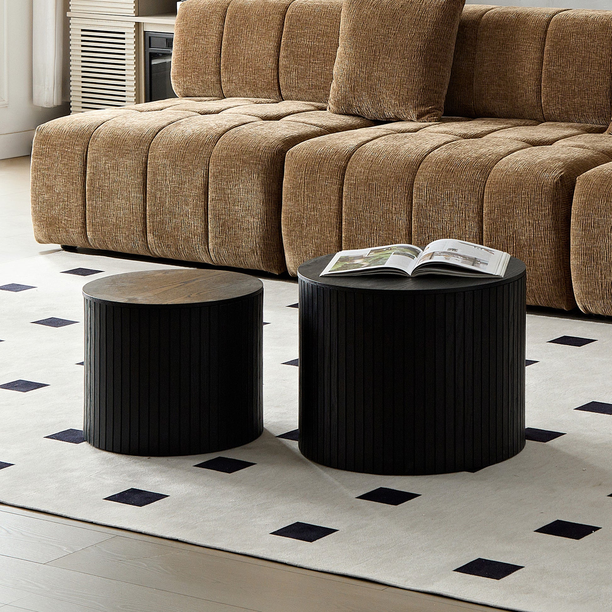 Modern black cylindrical coffee table with ribbed texture and oak top