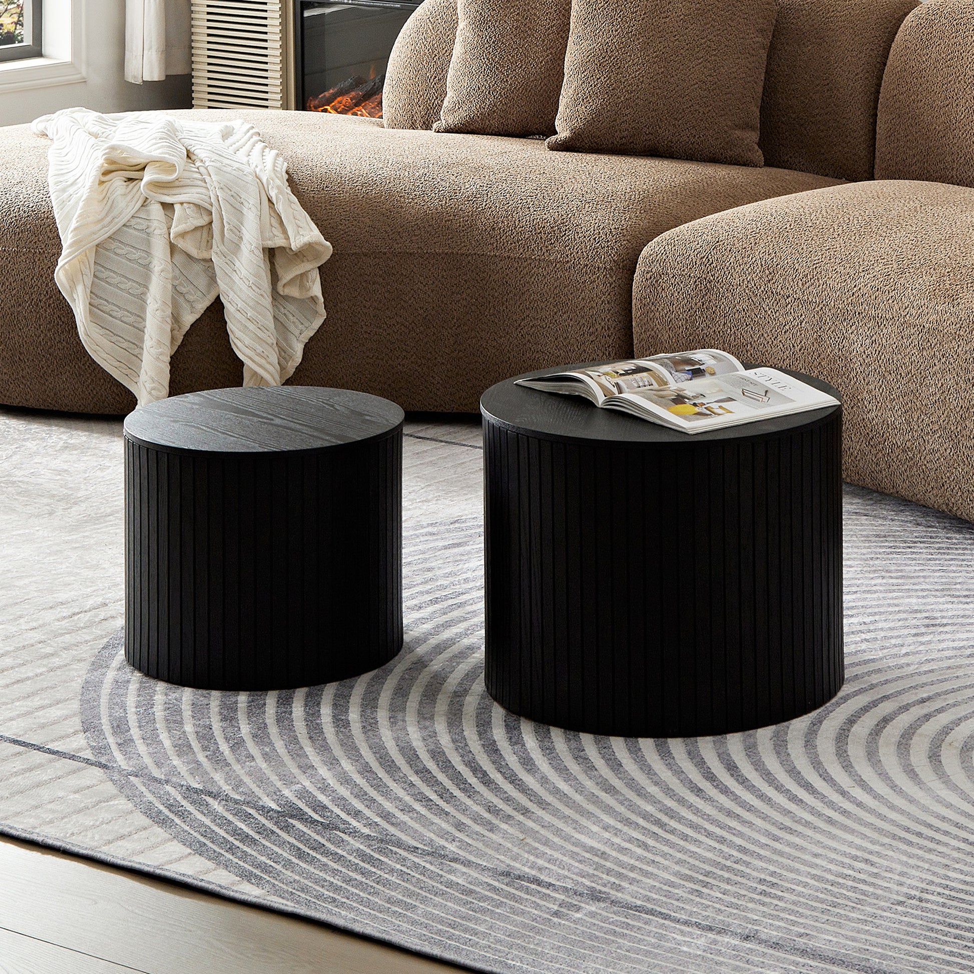 Black fluted drum coffee table with a modern wood grain top ideal for contemporary living rooms