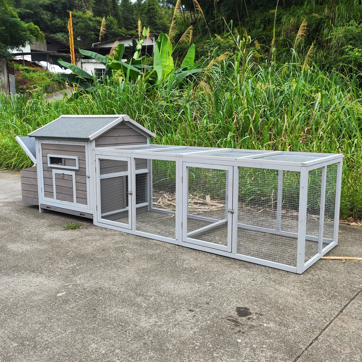 Wooden chicken coop with nesting box and large wire mesh run