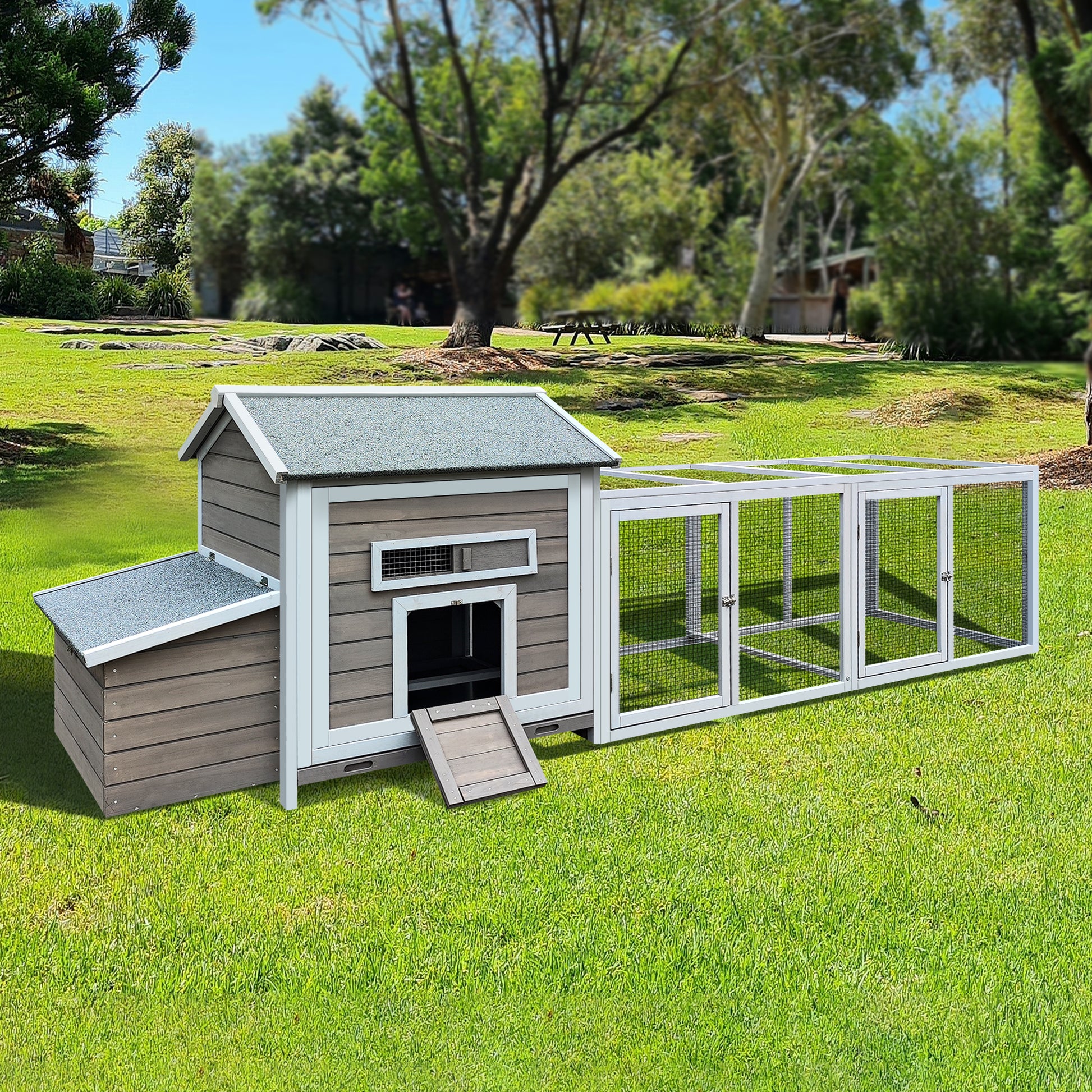 Spacious wooden chicken coop with attached wire run featuring a grey roof and multiple entry points