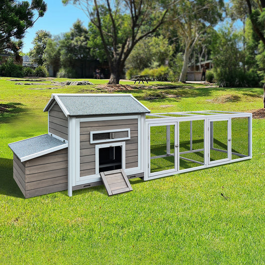 Spacious wooden chicken coop with attached wire run featuring a grey roof and multiple entry points