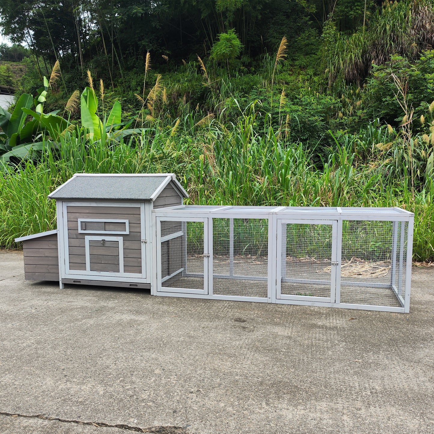 Gray wooden chicken coop with attached outdoor run spacious design for backyard poultry