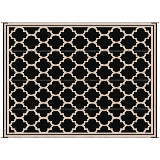 Black and cream geometric quatrefoil pattern indoor area rug