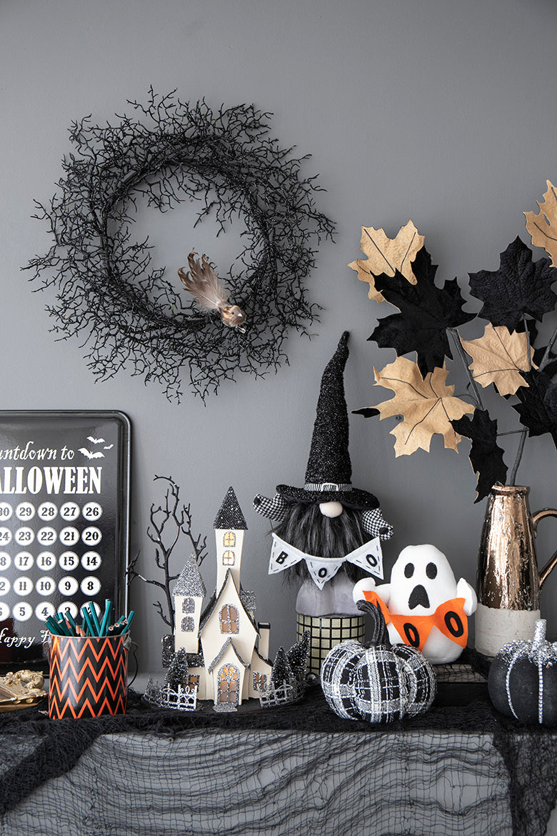 Black twig Halloween wreath with feather accent for festive decor