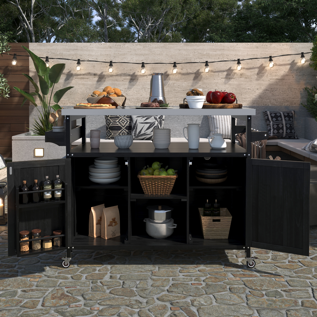 Outdoor kitchen island with black wood doors and stainless steel countertop