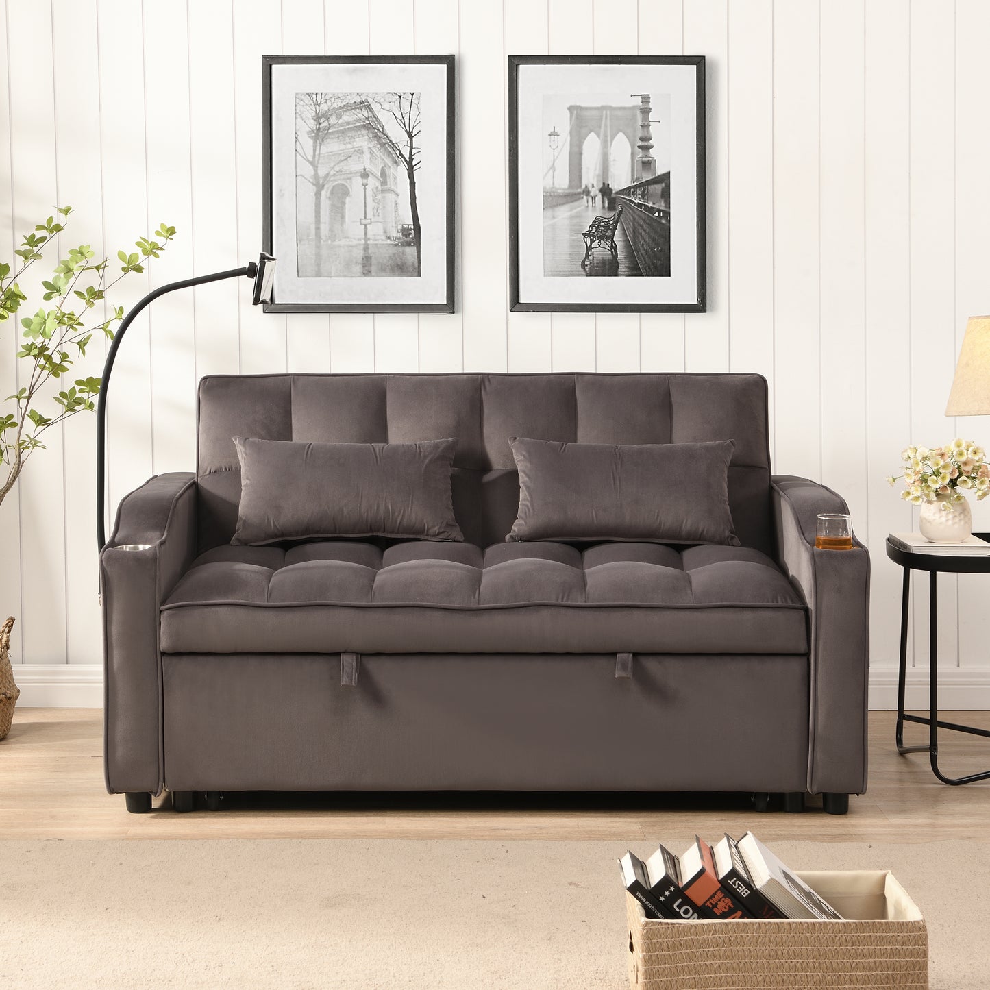 Grey velvet sofa with tufted cushions and two pillows