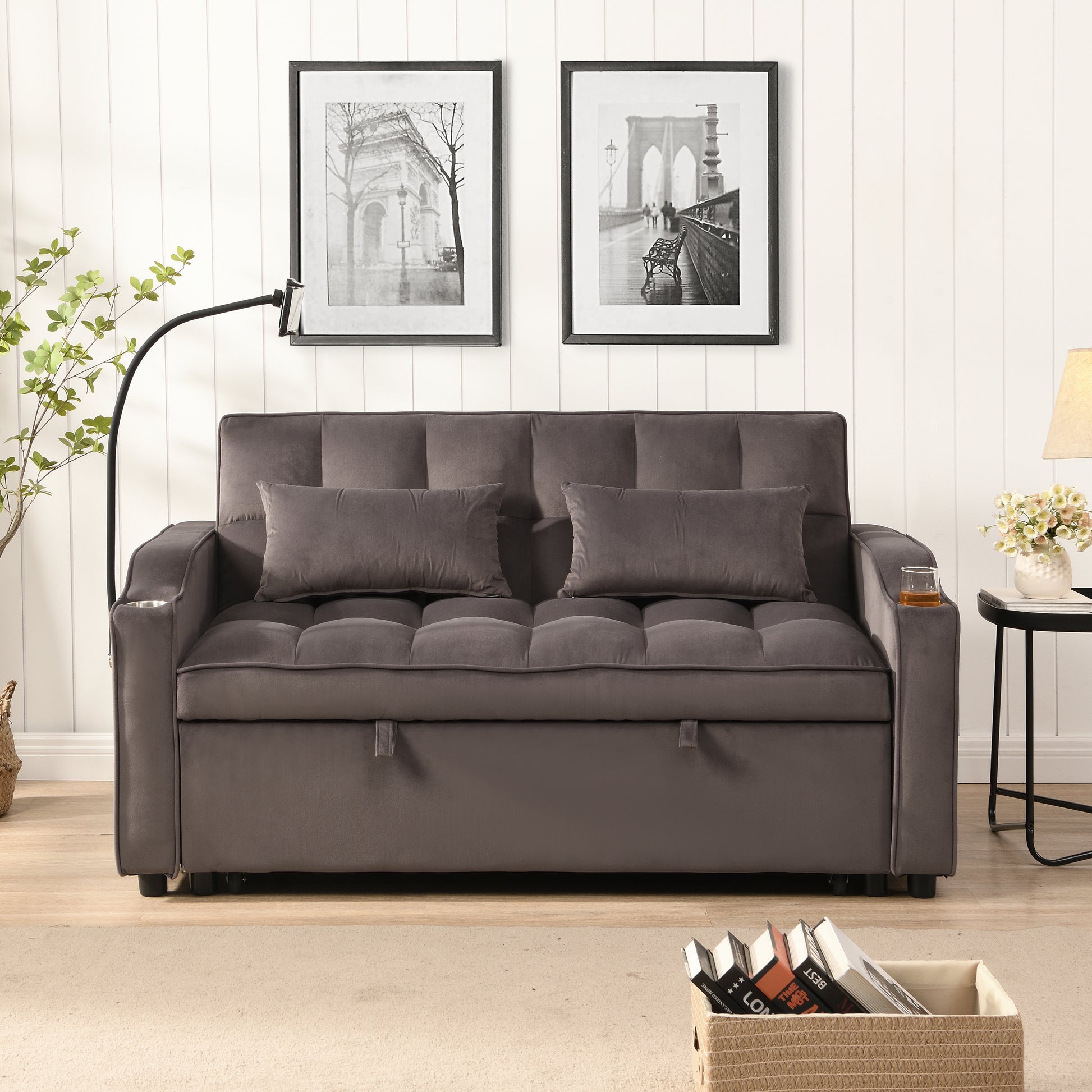 Grey velvet sofa with tufted cushions and two pillows