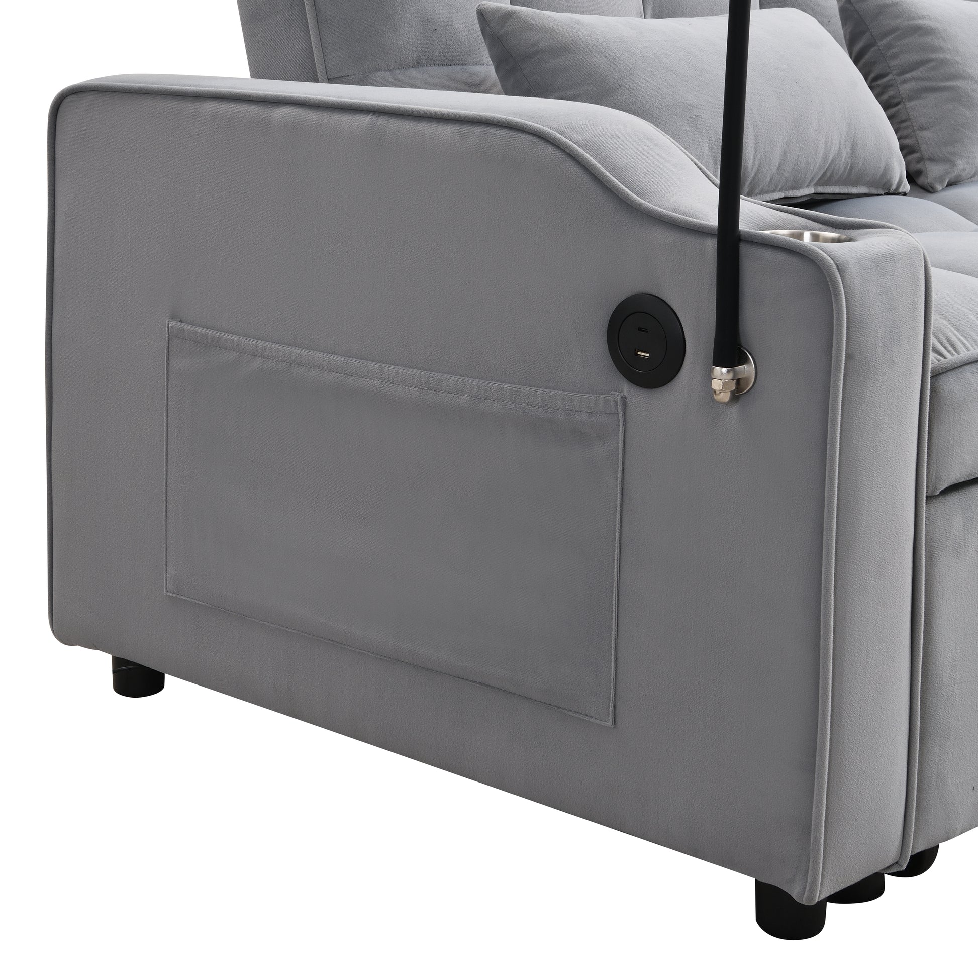 Gray velvet sofa armrest with builtin USB charging ports and a cup holder