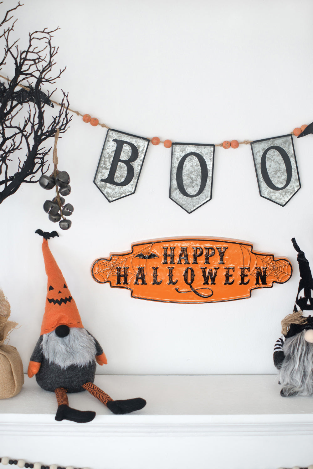Felt Halloween gnome with orange pumpkin hat and striped legs festive decor