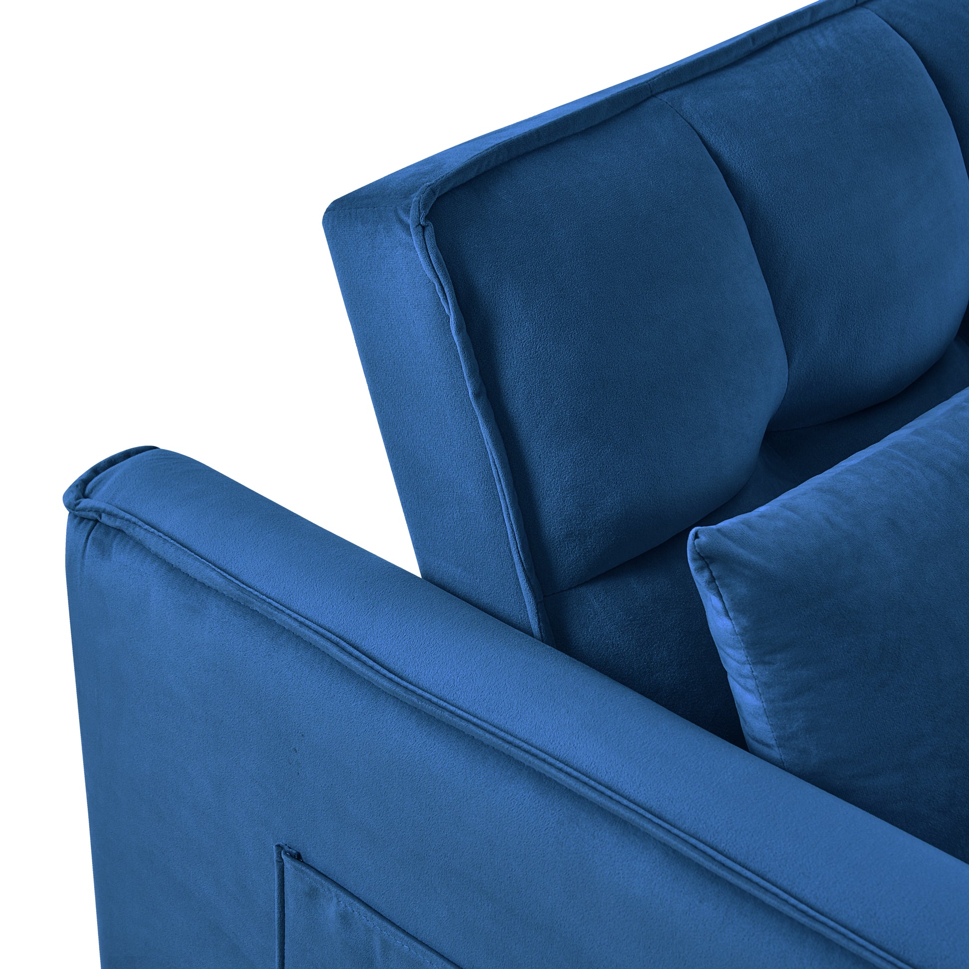 Closeup of a plush velvet blue sofa with tufted back cushions for comfort