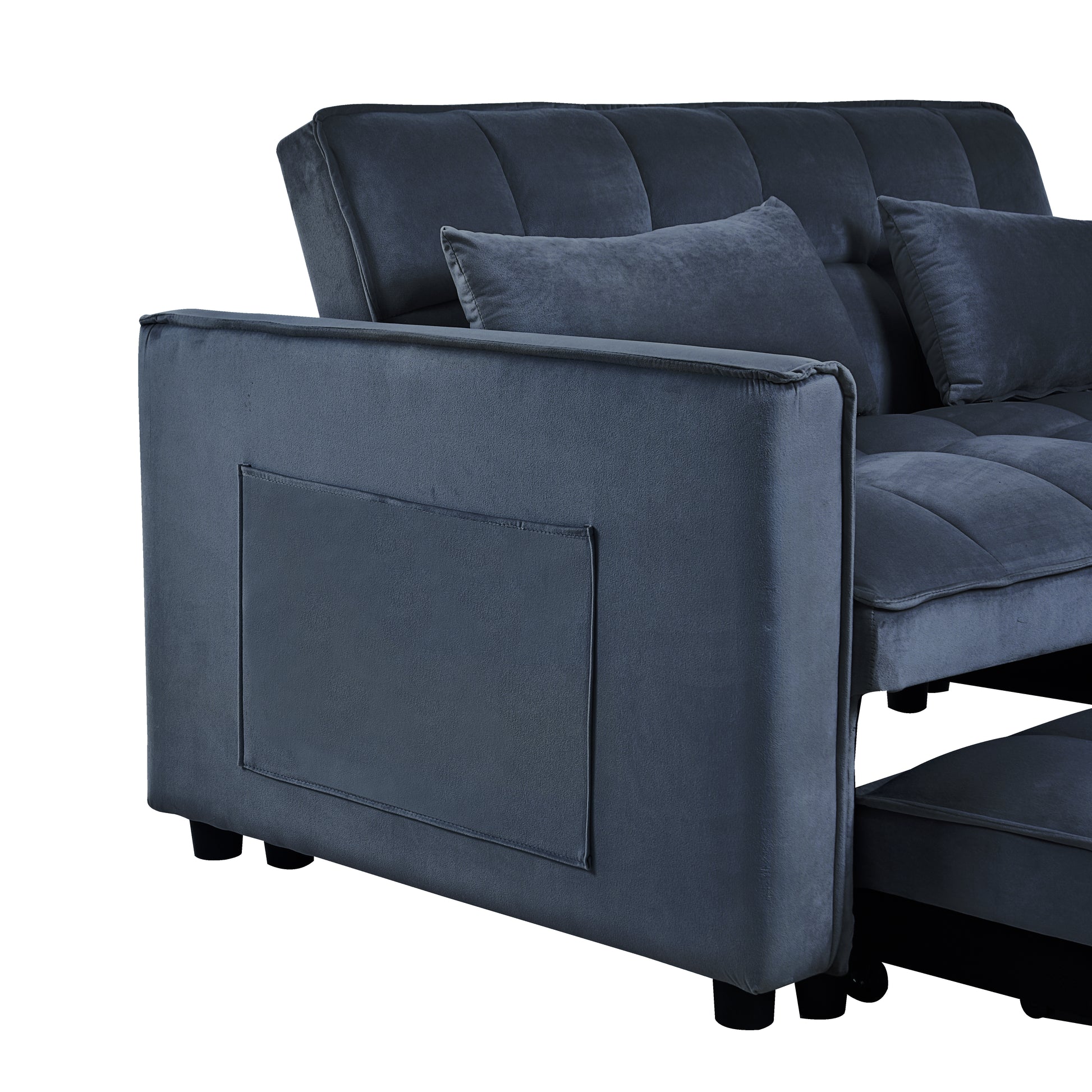 Dark gray velvet sofa with tufted back cushions and a side storage pocket