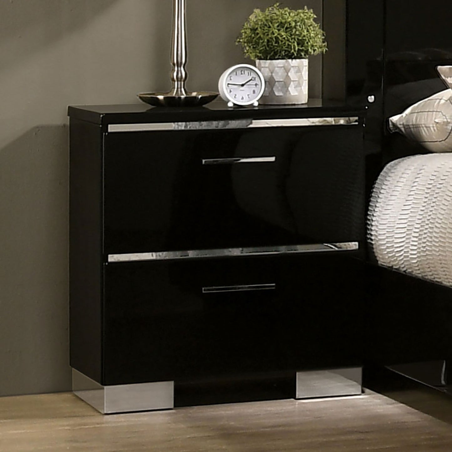 Sleek black nightstand with two drawers polished chrome accents and silver block feet