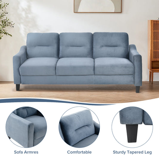 Light blue velvet sofa with three plush seat cushions and integrated armrests