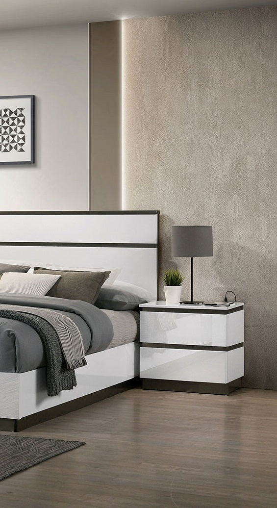 Modern white and grey upholstered bed with sleek bedside table