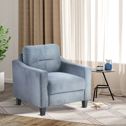 Plush blue velvet accent chair with a comfortable lumbar pillow perfect for modern living rooms