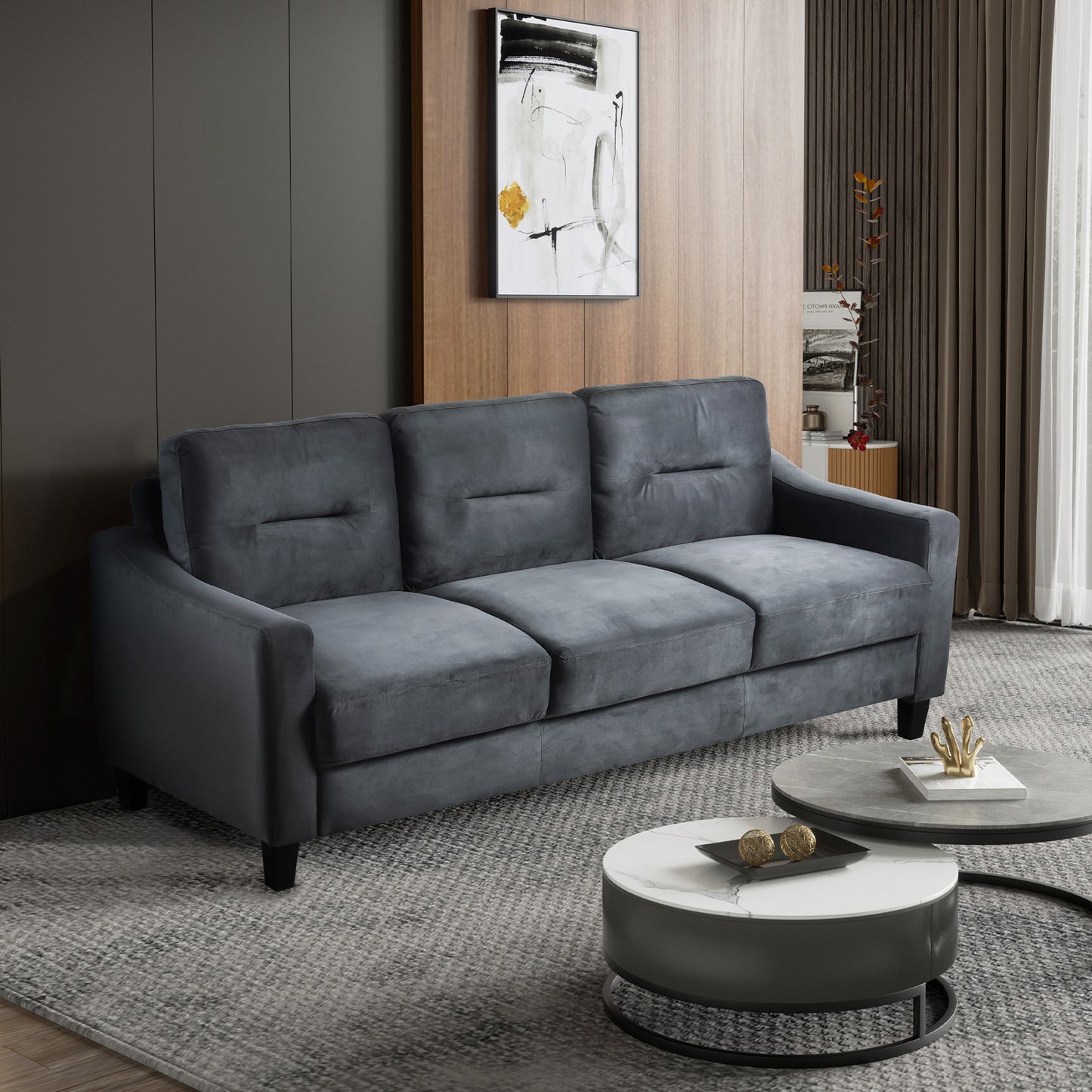 Dark gray velvet threeseater sofa with tufted back cushions for modern living rooms