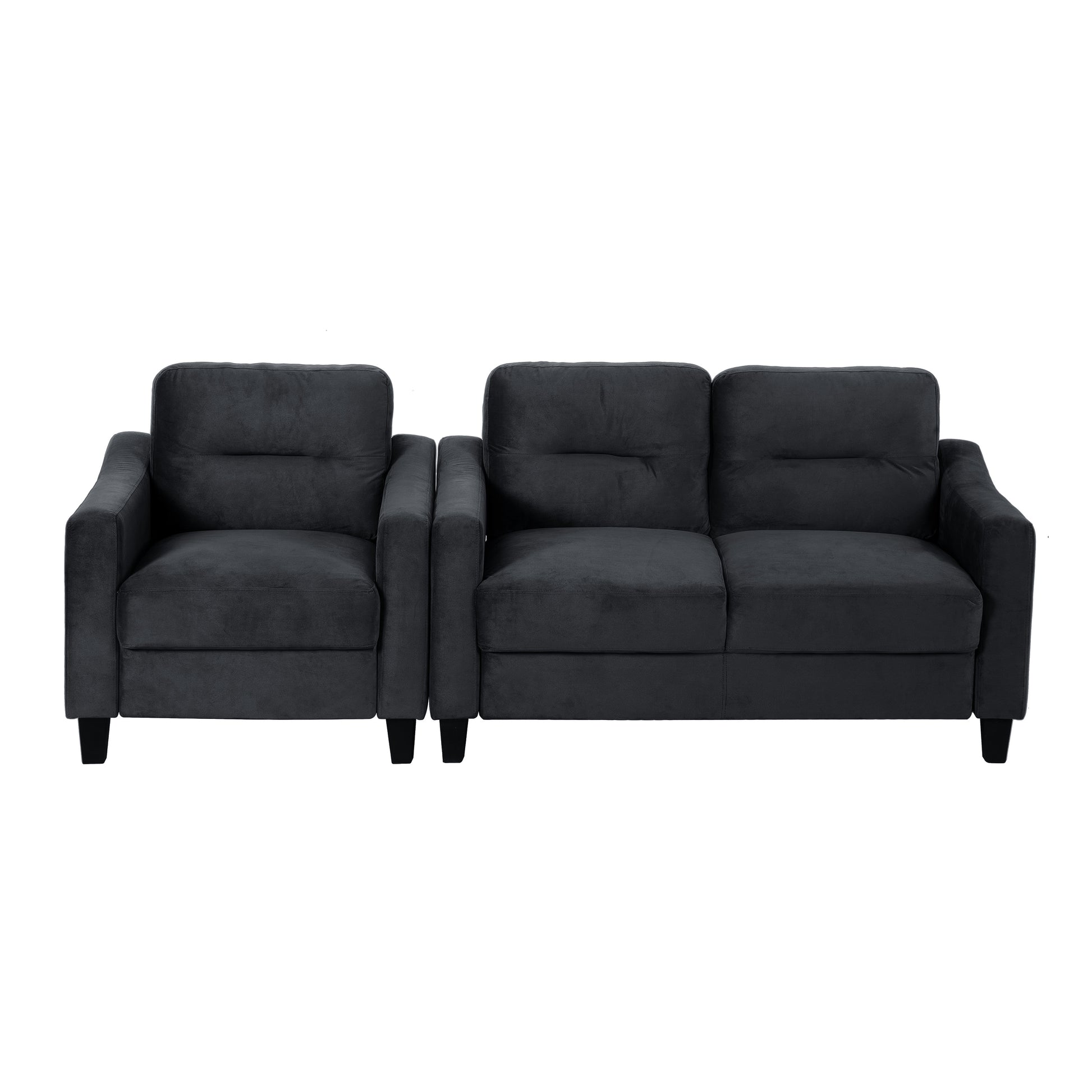 Dark grey velvet armchair with plush cushions and sturdy black legs