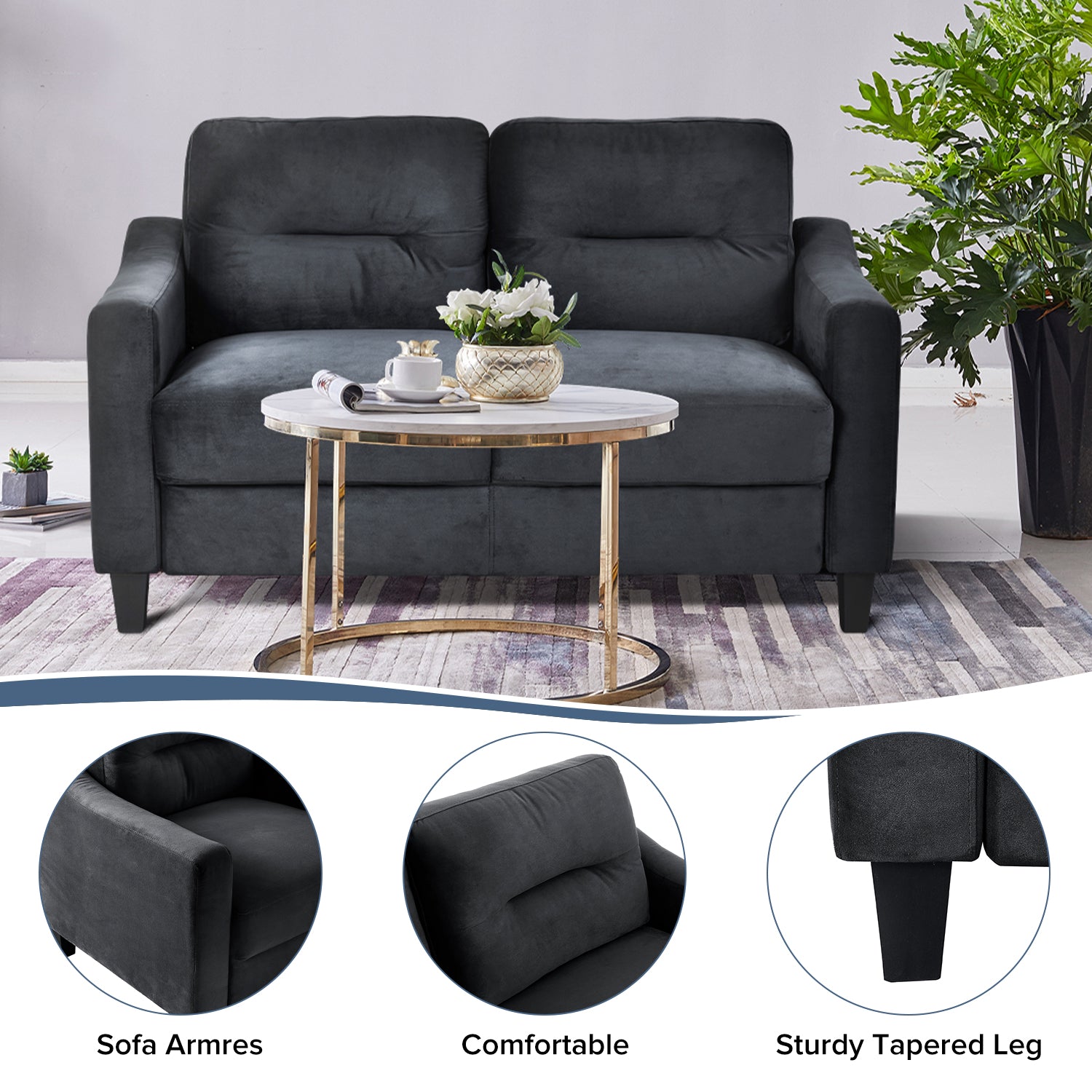 Charcoal grey velvet sofa with plush cushions and gold accents