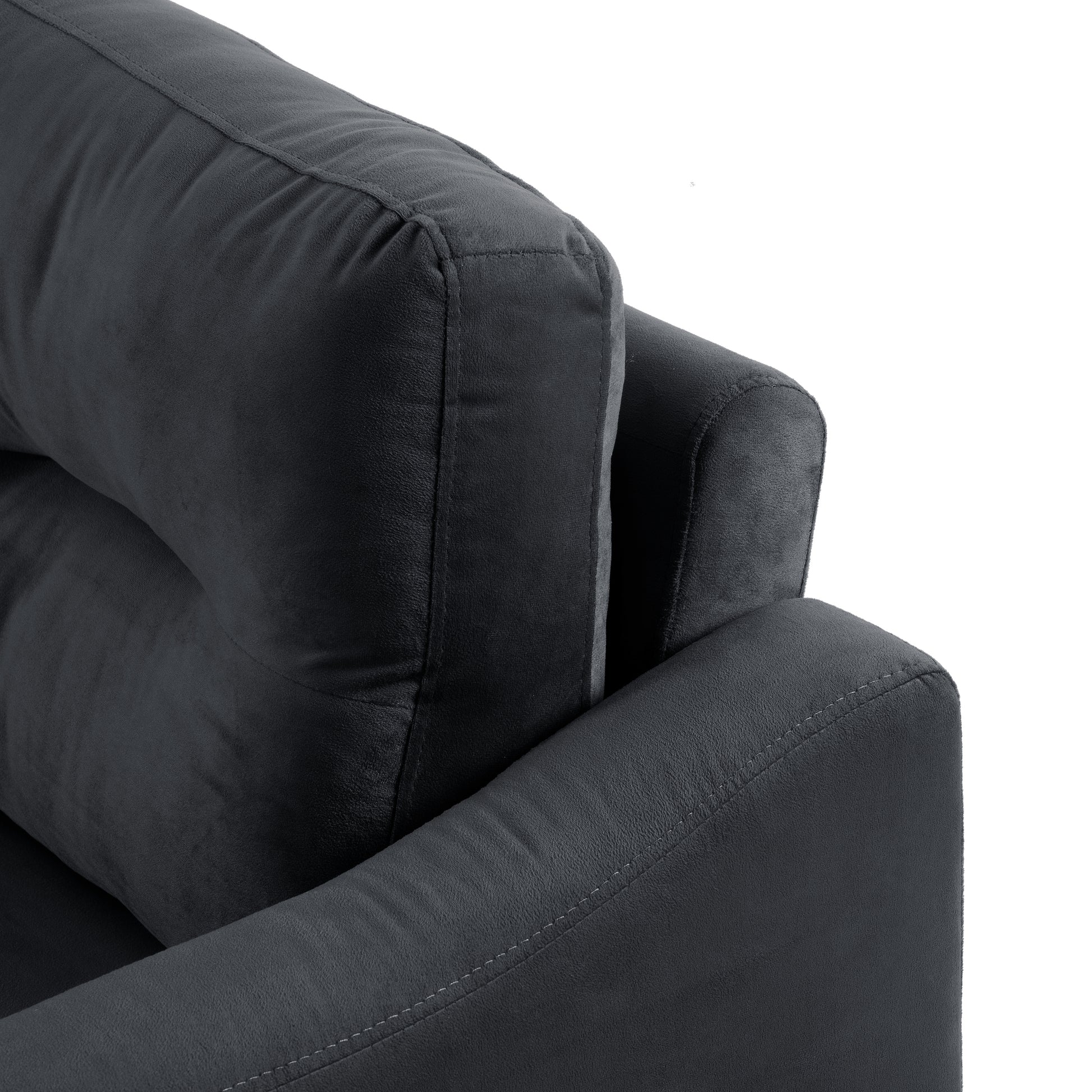 Dark grey plush velvet sofa detail showing textured fabric and stitching