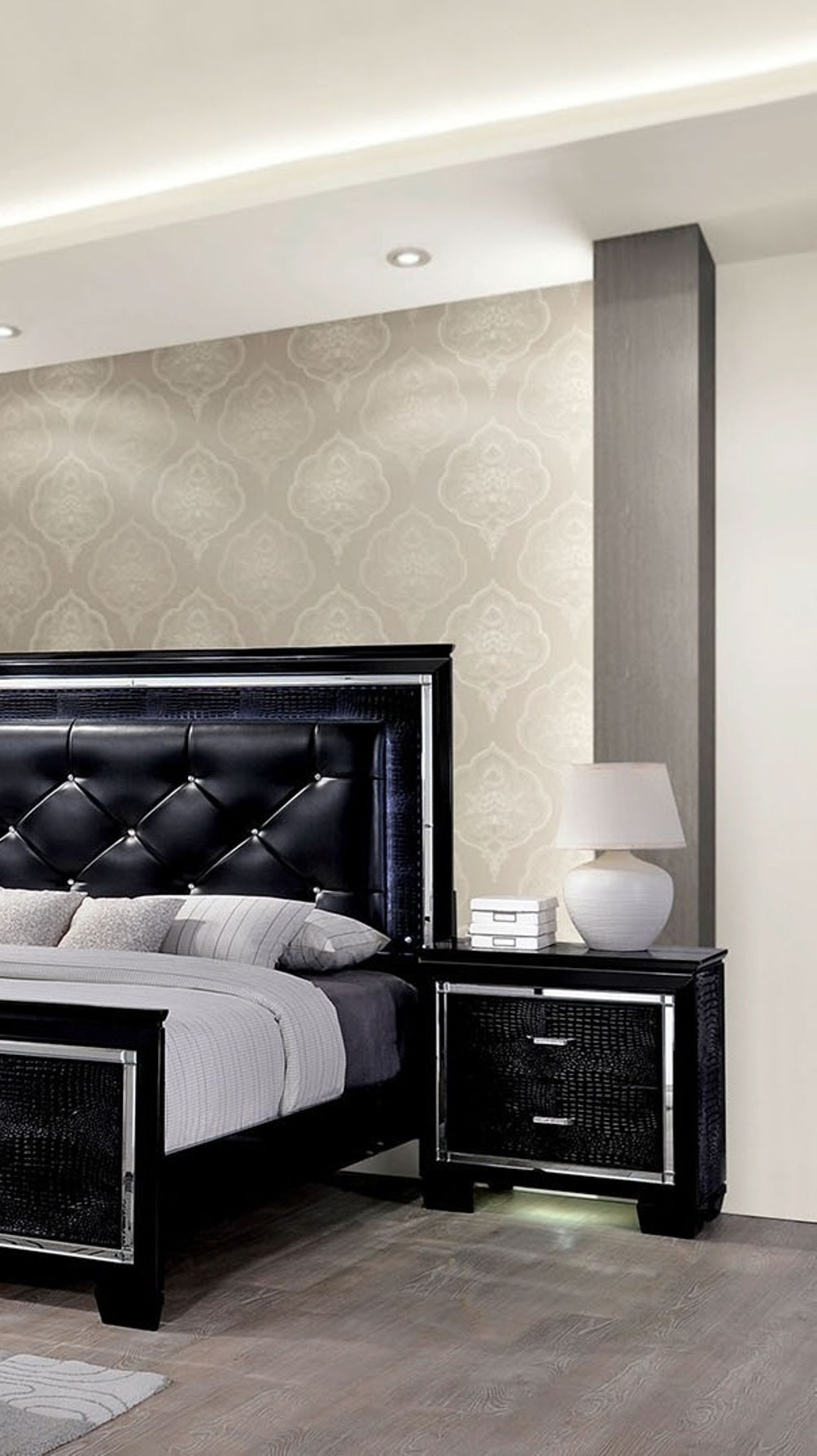 Black tufted leather king bed with crystal accents