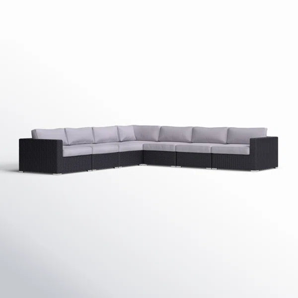 Black wicker sectional sofa with light gray cushions for outdoor patio seating