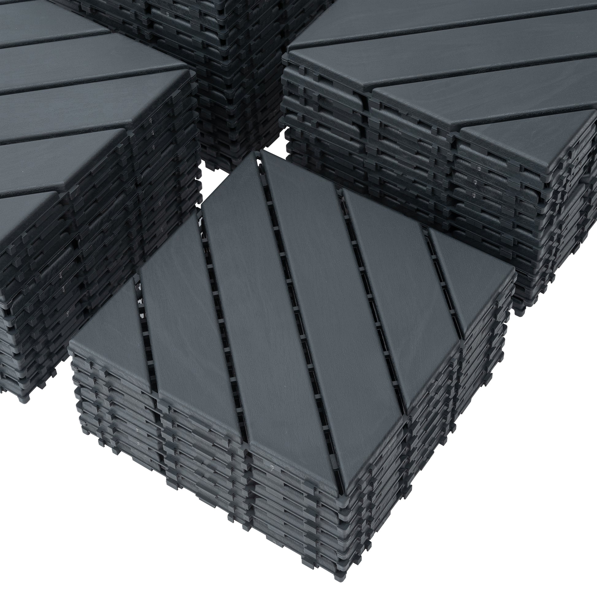Stack of dark gray interlocking deck tiles with wood grain texture