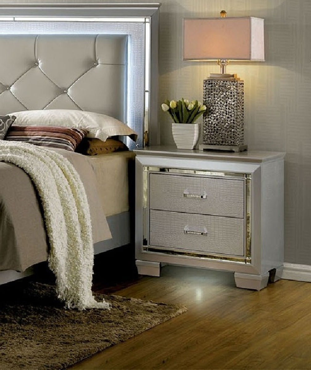 Silver mirrored nightstand with textured drawers and crystal knobs