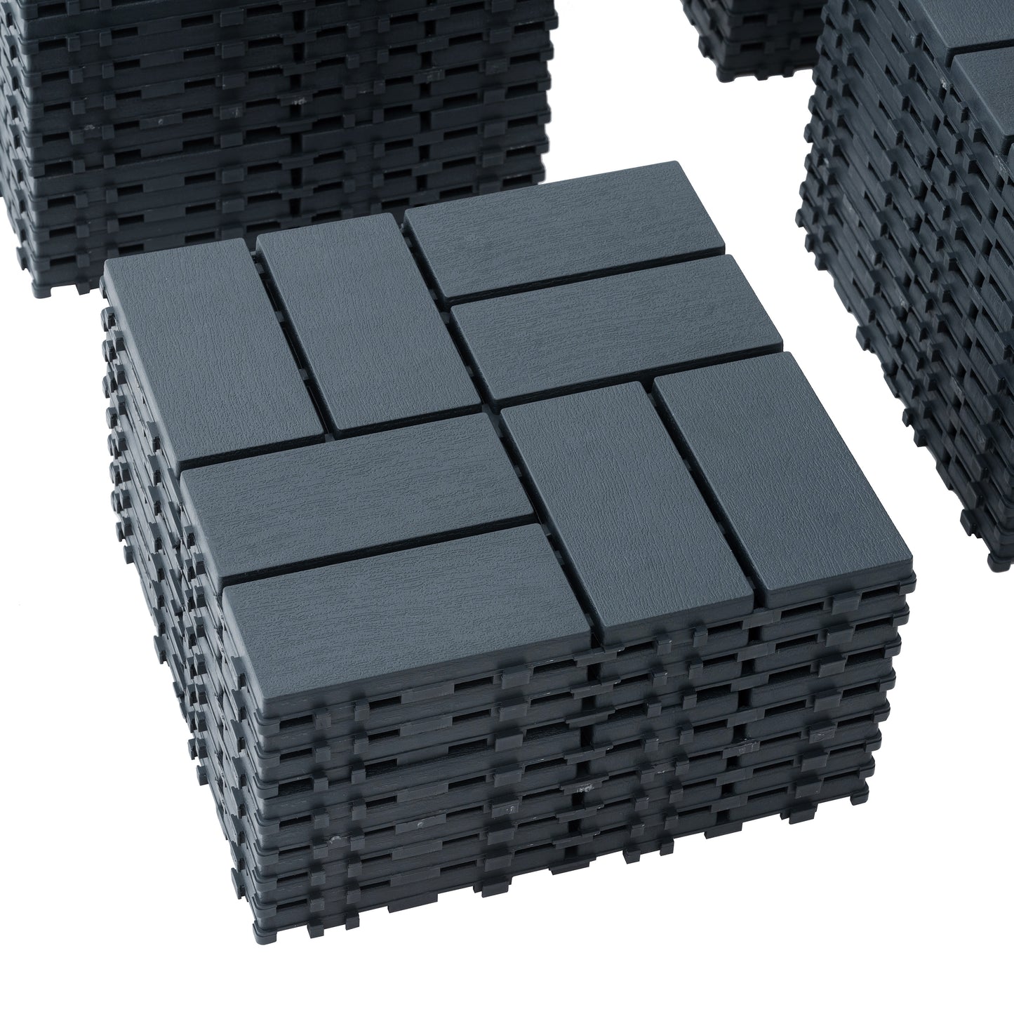 Stack of dark grey interlocking deck tiles with a wood grain texture
