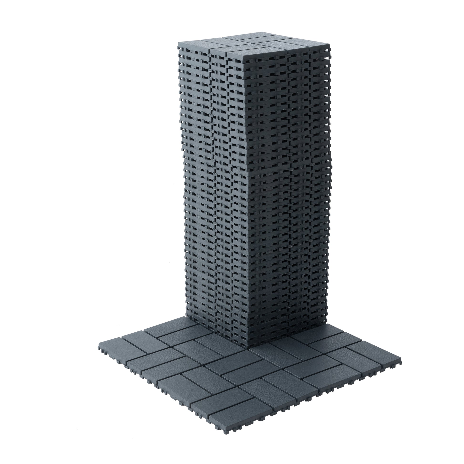 Stack of dark grey interlocking deck tiles for outdoor flooring