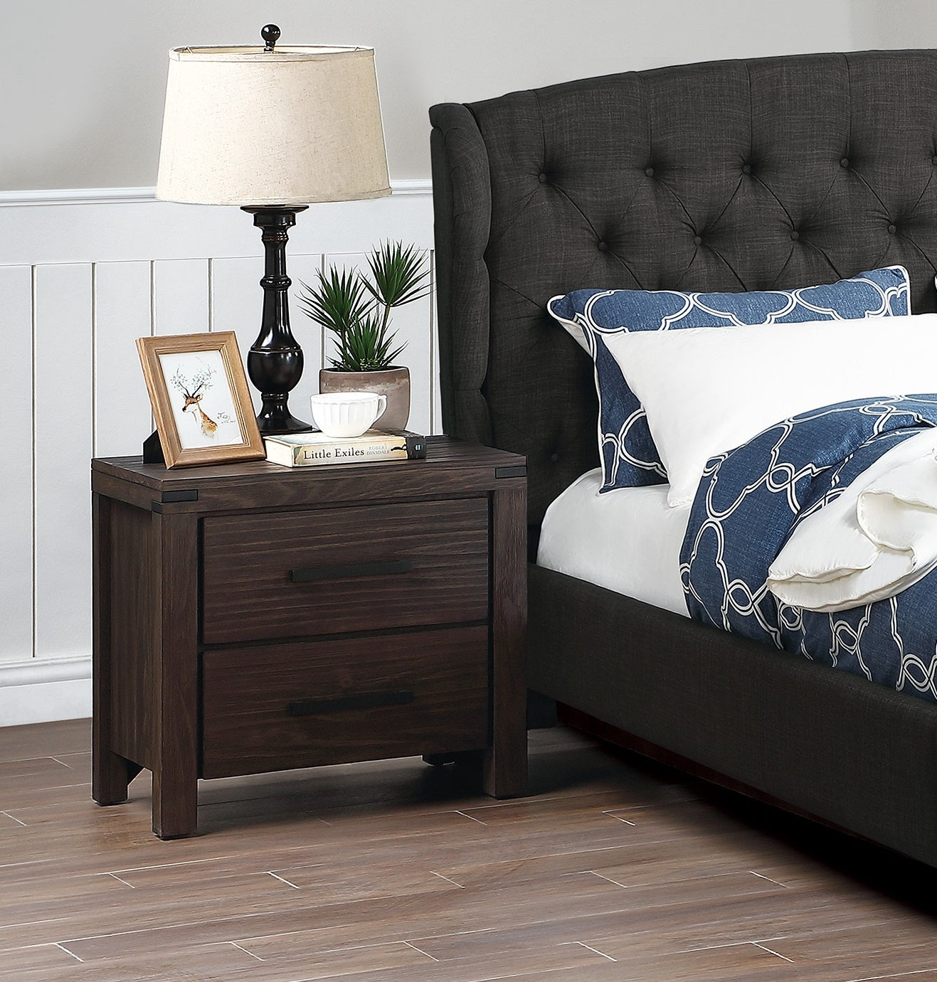 Dark wood twodrawer nightstand with metal accents complementing a bedroom set