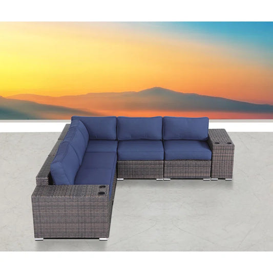 Dark grey wicker sectional sofa with navy blue cushions perfect for outdoor patios