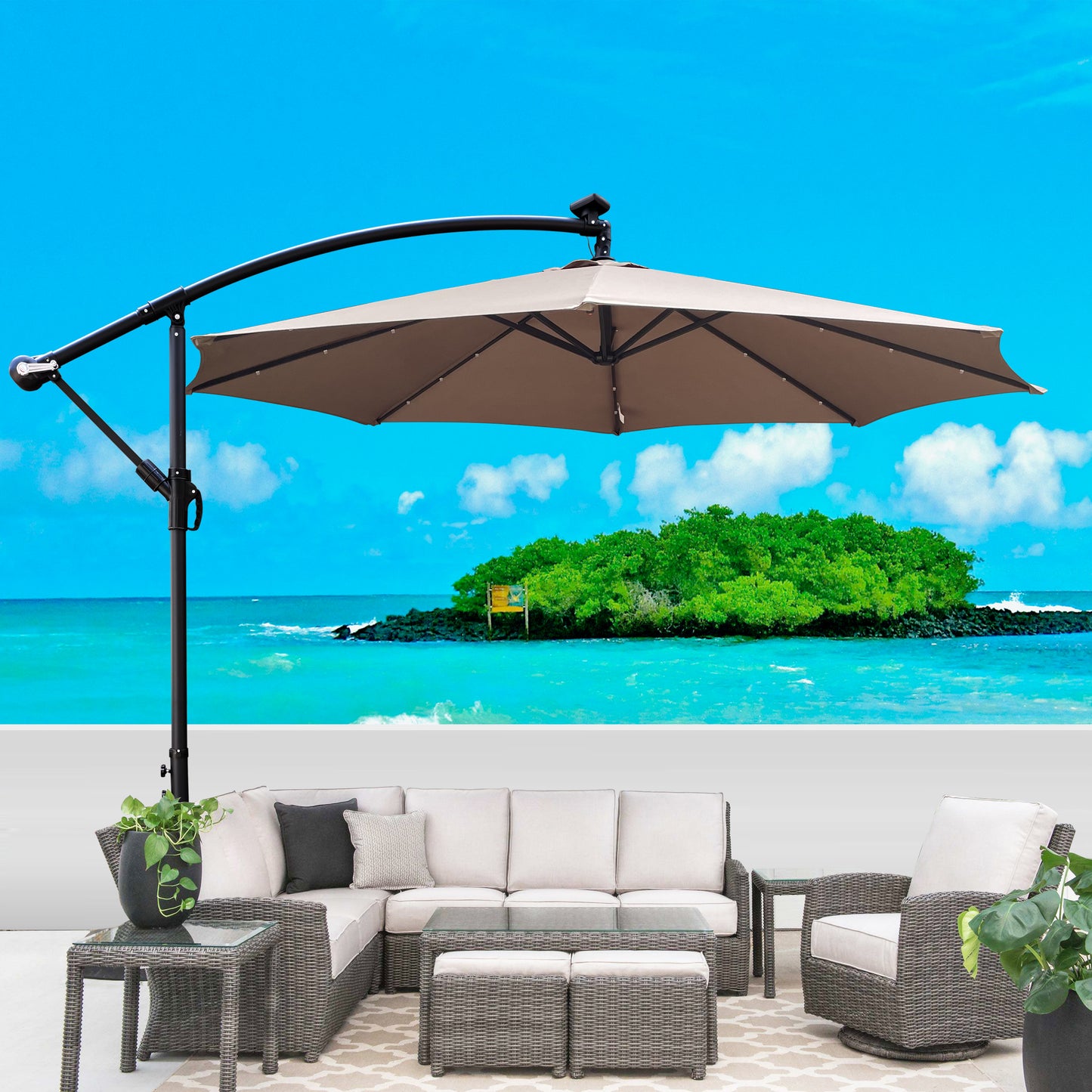 Large offset patio umbrella with taupe canopy and gray wicker furniture set for outdoor relaxation