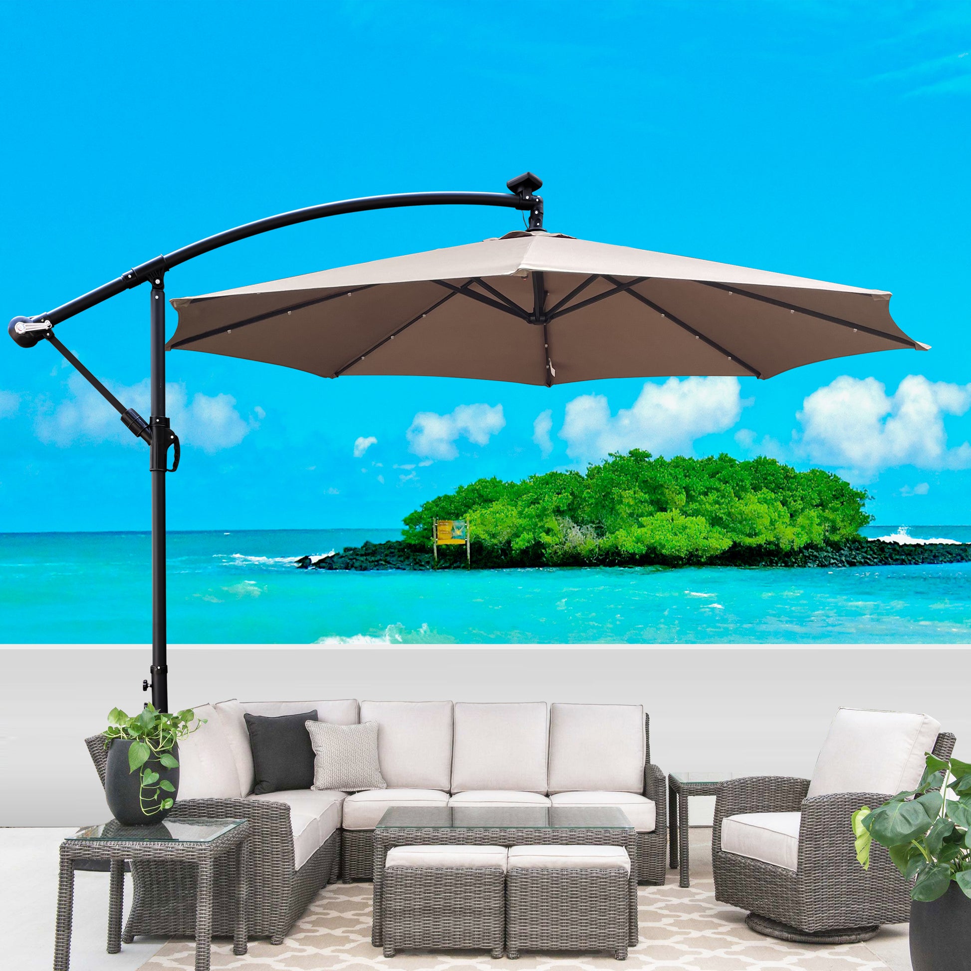 Large offset patio umbrella with taupe canopy and gray wicker furniture set for outdoor relaxation