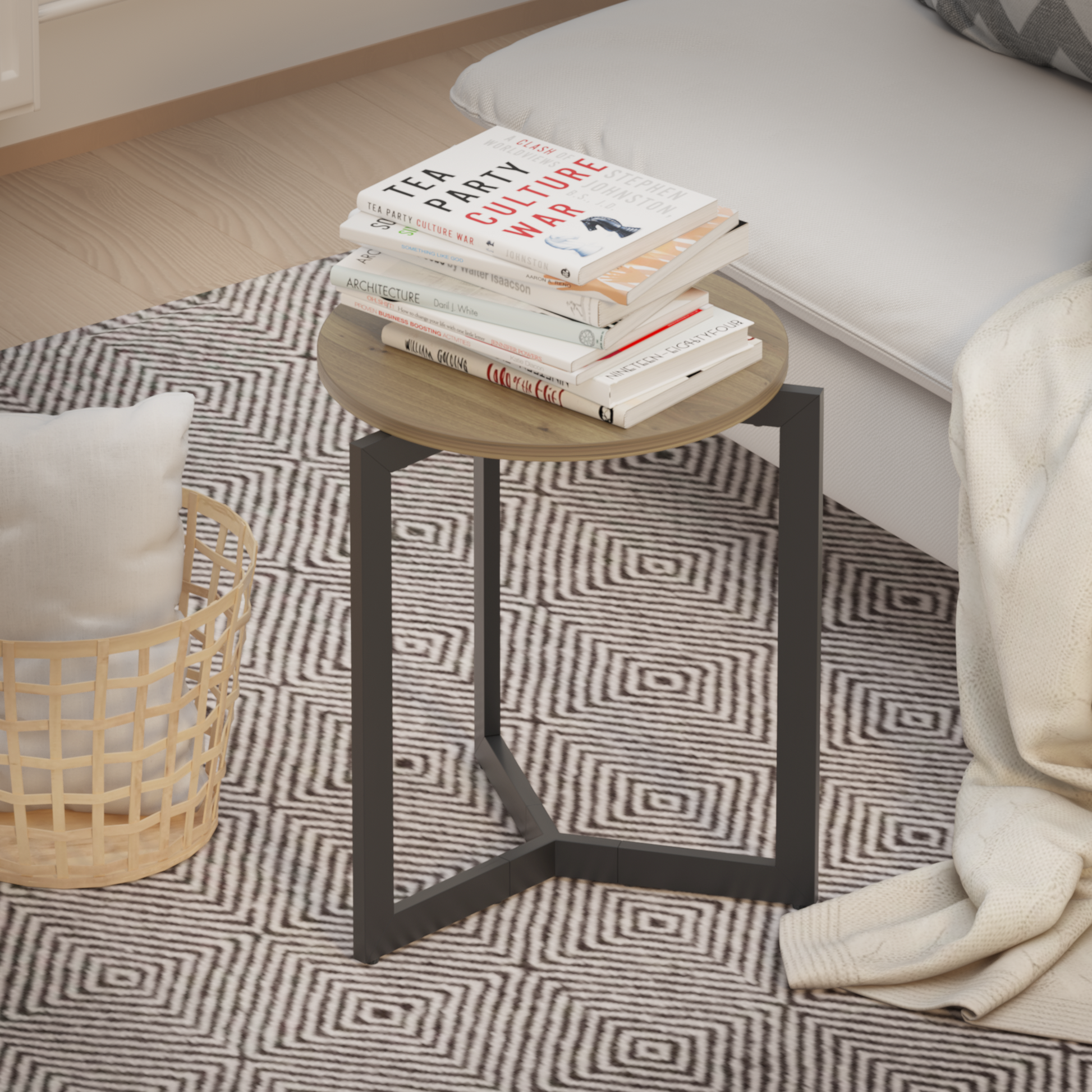 Round woodtop end table with black metal base holding a stack of books