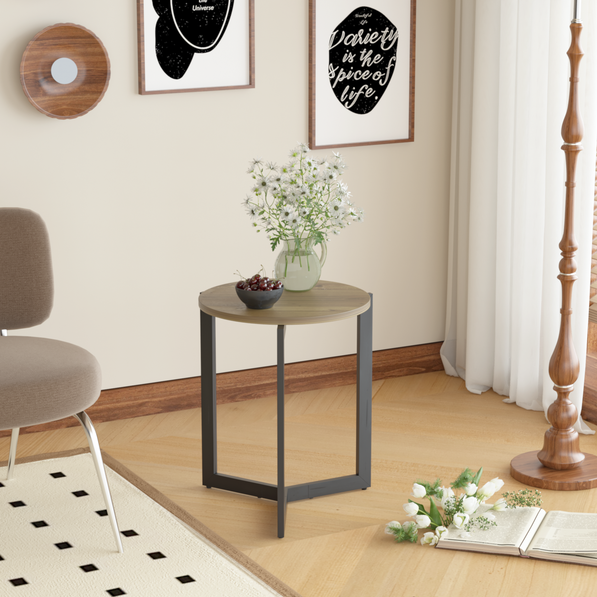 Round wood side table with black metal legs holding a bowl of cherries