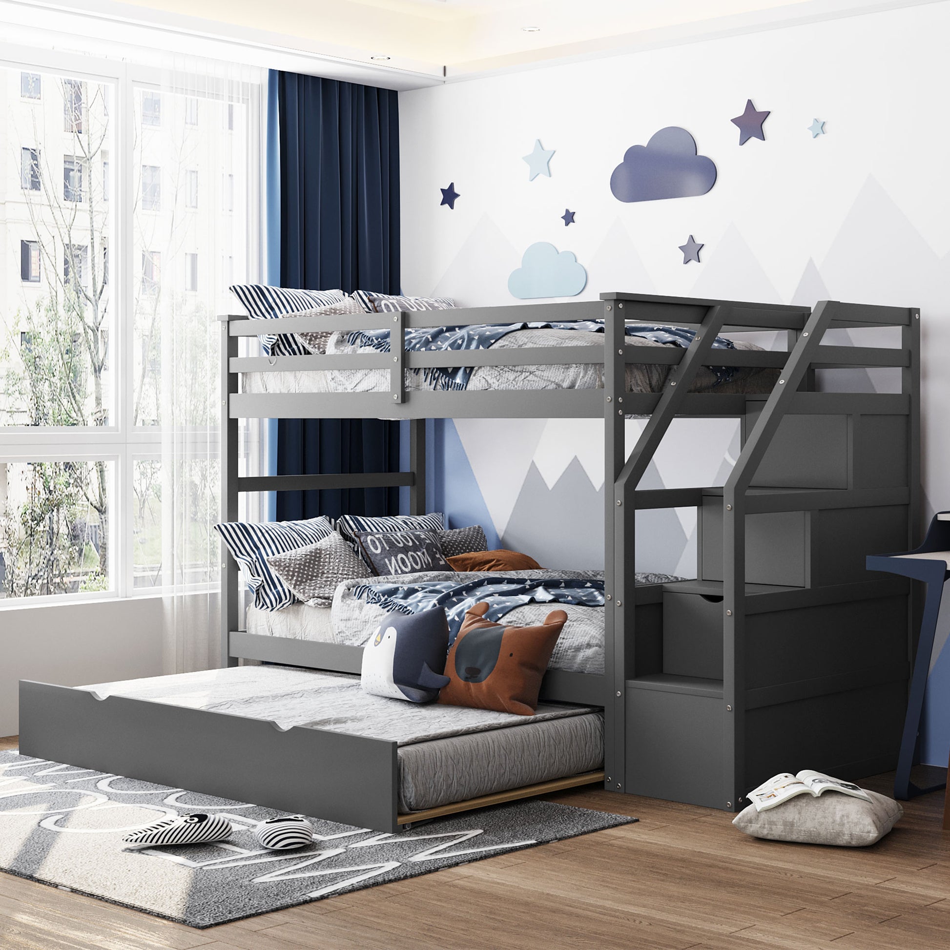 Gray wooden triple bunk bed with stairs and pullout trundle featuring navy bedding
