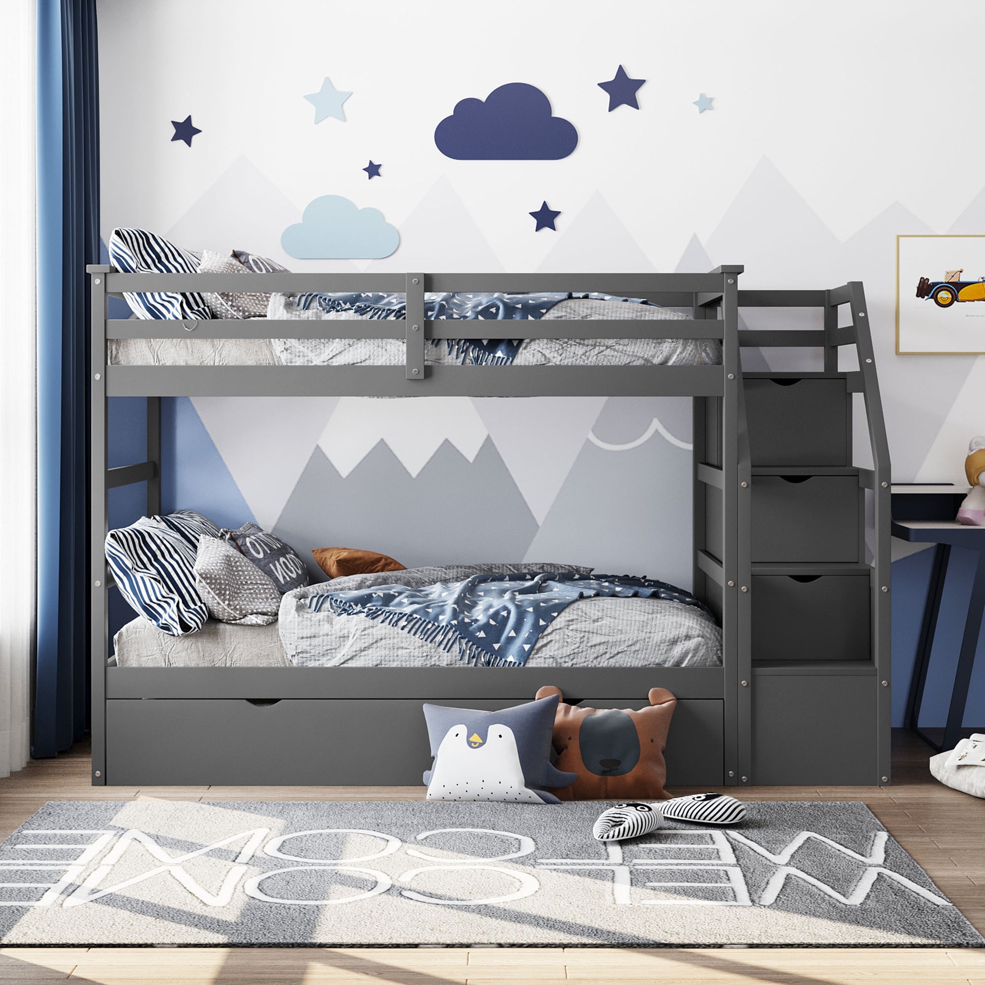 Gray wooden twin over twin bunk bed with drawers and fun mountain wall art