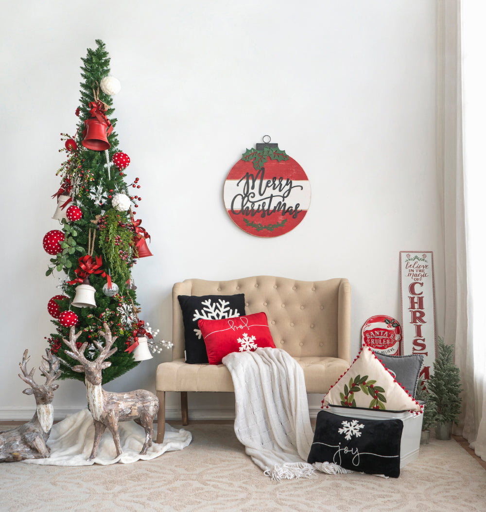 Decorated Christmas tree with red bells ornaments and snowflakes